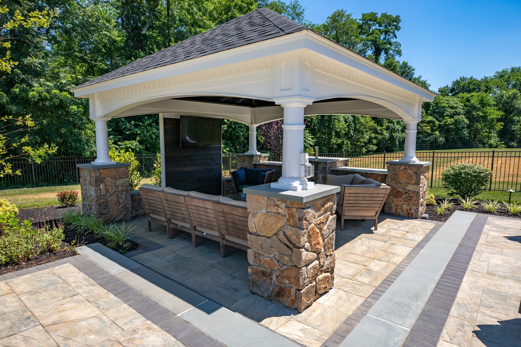Outdoor seating area covered by pavilion| Outdoor living ideas for fall | Creative Pavers