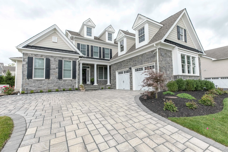 Front of house with paver driveway | Fall Hardscape Upgrades | Creative Pavers